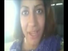 In my automobile, a chubby Indian prostitute shows her breasts.